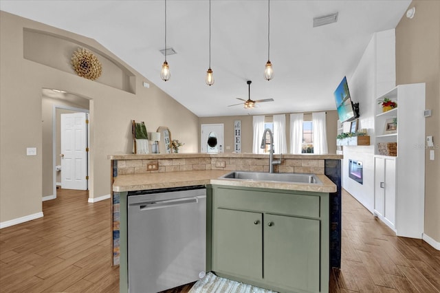 kitchen with a sink, visible vents, light countertops, stainless steel dishwasher, and green cabinetry