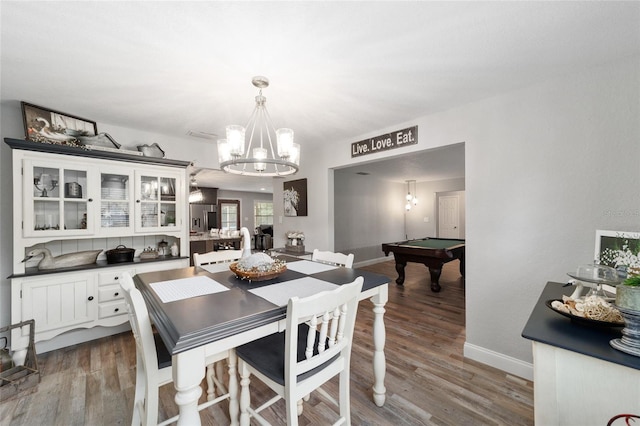 dining space with baseboards, billiards, a chandelier, and dark wood-type flooring