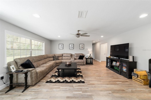 living room featuring baseboards, wood finished floors, visible vents, and recessed lighting