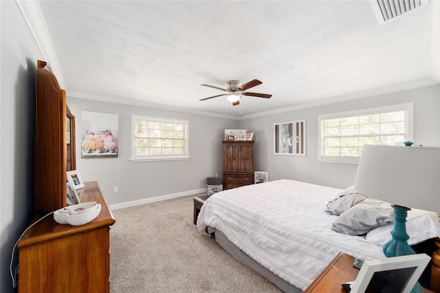 bedroom with carpet floors, multiple windows, and crown molding