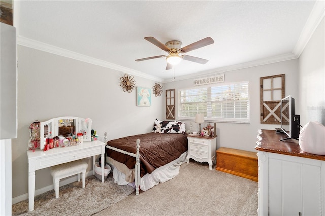 carpeted bedroom featuring ceiling fan, ornamental molding, and baseboards