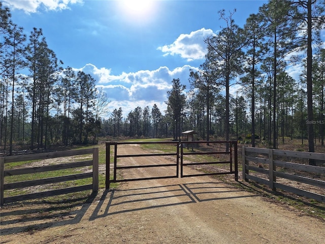 view of gate featuring fence