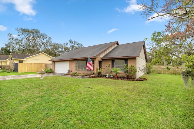 view of front facade featuring brick siding, concrete driveway, a front yard, fence, and a garage