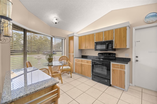 kitchen featuring lofted ceiling, light tile patterned floors, a textured ceiling, black appliances, and dark countertops