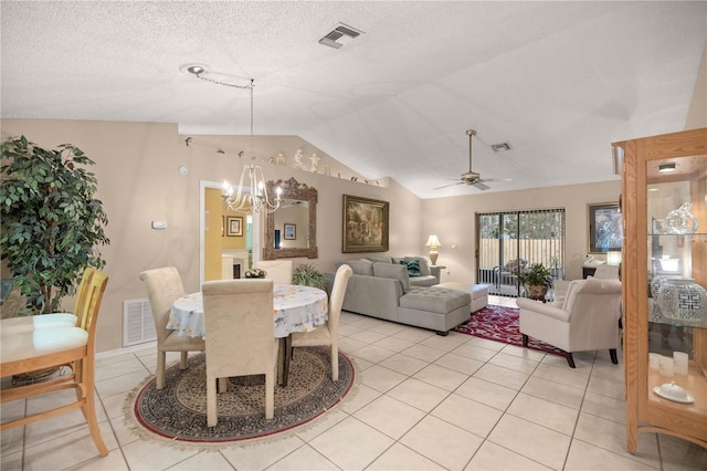 dining space featuring vaulted ceiling, light tile patterned flooring, and visible vents