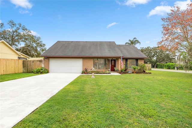 view of front of house featuring a garage, a front yard, driveway, and fence