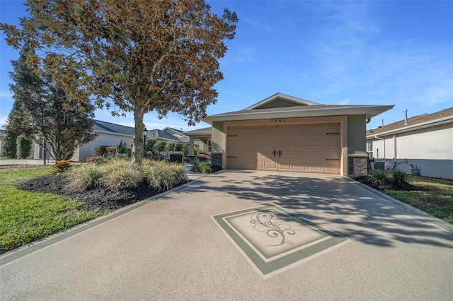 view of front of property featuring a garage, stone siding, driveway, and stucco siding