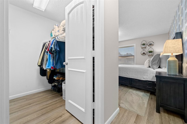 spacious closet with light wood finished floors