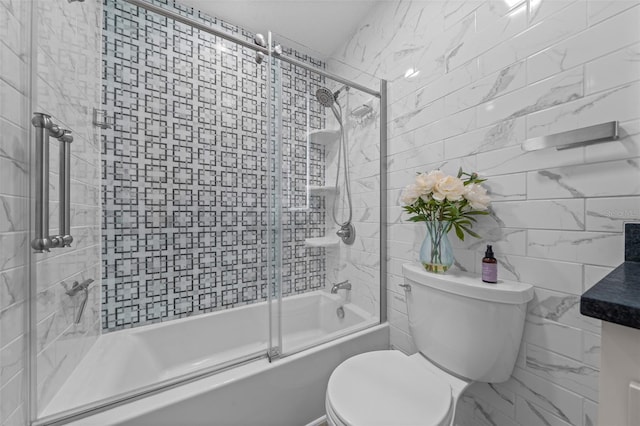 bathroom with toilet, shower / bath combination with glass door, tile walls, and vanity