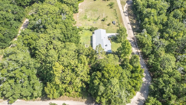 drone / aerial view featuring a view of trees