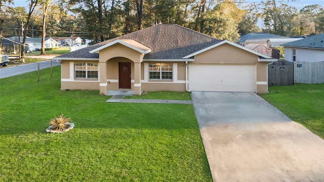 ranch-style home with a front yard, an attached garage, and stucco siding