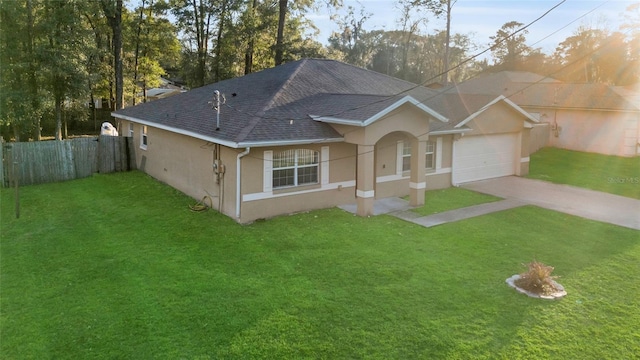 ranch-style house with a garage, a front lawn, fence, and stucco siding