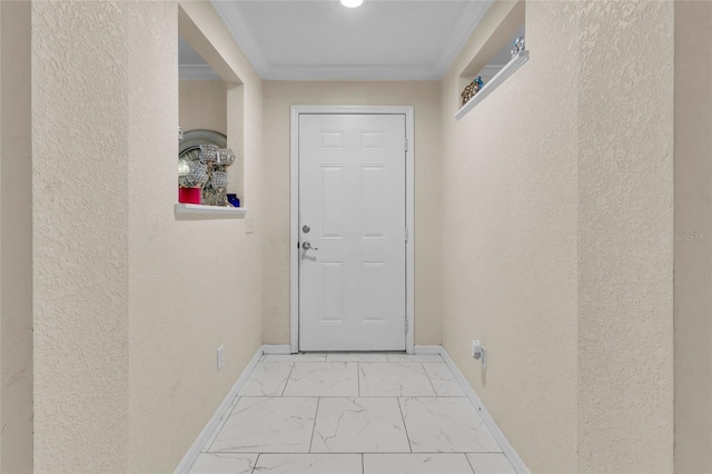 doorway to outside featuring marble finish floor, baseboards, and a textured wall