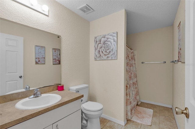 full bath featuring visible vents, toilet, tile patterned floors, a textured ceiling, and vanity