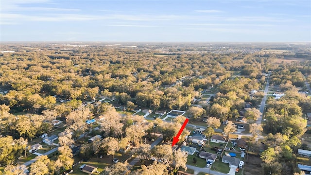 birds eye view of property with a forest view