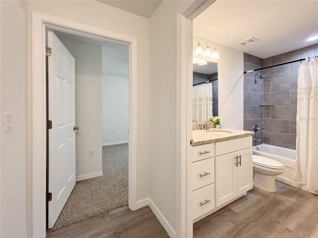 full bath featuring shower / bath combination with curtain, visible vents, toilet, vanity, and wood finished floors