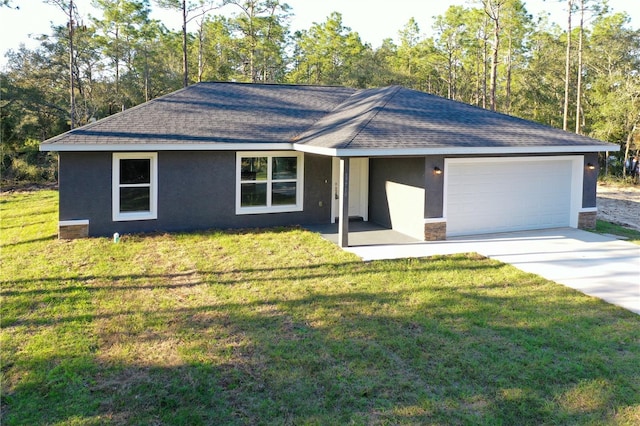 ranch-style house featuring an attached garage, a shingled roof, a front yard, and stucco siding