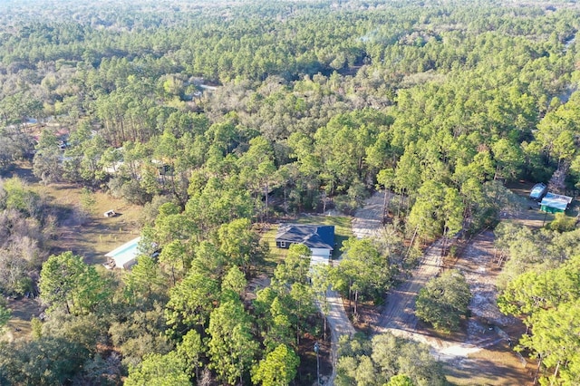 bird's eye view featuring a forest view