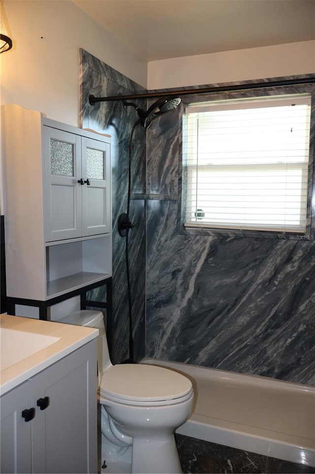 bathroom with toilet, a walk in shower, and vanity