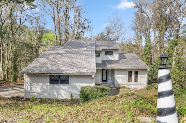 view of front of house with metal roof and french doors