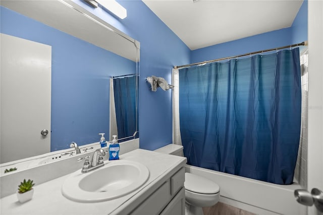 full bathroom with vanity, toilet, and shower / bath combo with shower curtain