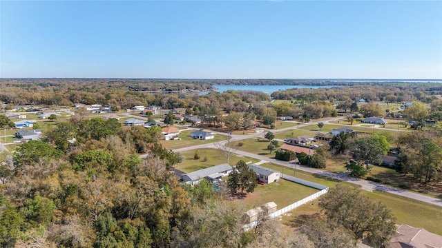 bird's eye view with a wooded view and a water view