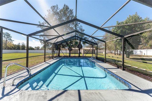 view of pool with a lanai, a yard, a patio area, and a fenced in pool