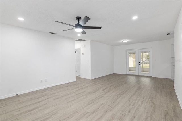 unfurnished room with french doors, visible vents, and light wood-style flooring