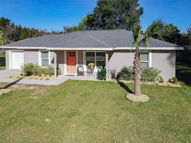 ranch-style house featuring a garage, a shingled roof, a front yard, and stucco siding