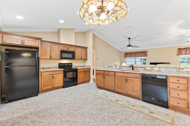 kitchen featuring black appliances, ornamental molding, vaulted ceiling, and a sink