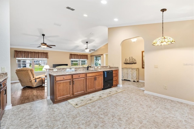 kitchen with brown cabinetry, open floor plan, visible vents, and ornamental molding