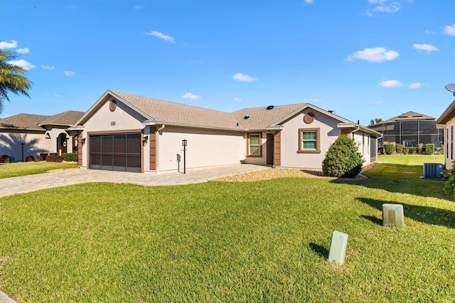 single story home featuring stucco siding, an attached garage, central AC, driveway, and a front lawn