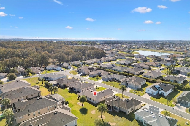 bird's eye view featuring a water view and a residential view