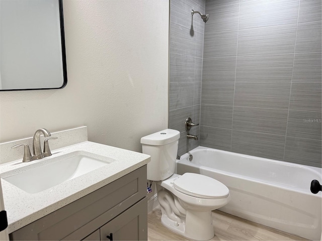 31 Juniper Pass Ln, Ocala, FL 34480 - bathroom featuring tub / shower combination, toilet, vanity, and wood finished floors