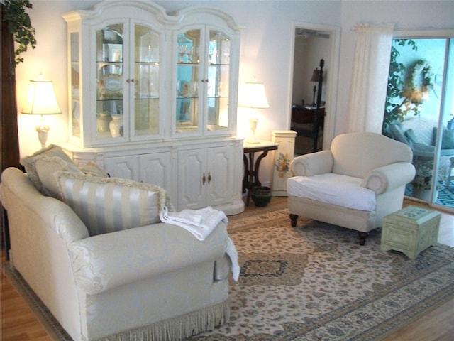 sitting room featuring wood finished floors