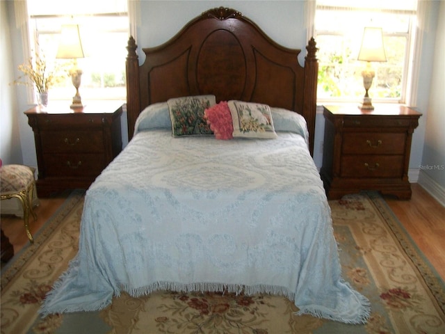 bedroom featuring light wood finished floors