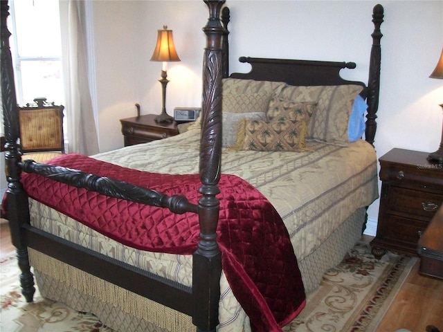 bedroom with wood finished floors