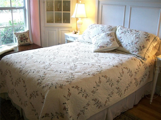 bedroom with wood finished floors