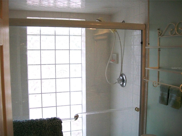 bathroom featuring a stall shower