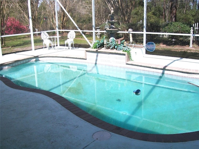 pool featuring a lanai and a patio