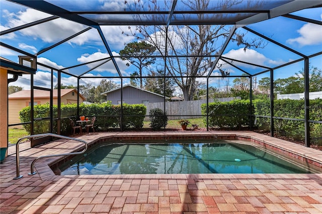 view of pool with a fenced in pool, a lanai, a patio, and fence