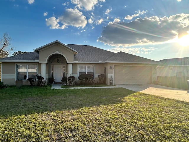 ranch-style house with roof with shingles, stucco siding, a garage, driveway, and a front lawn