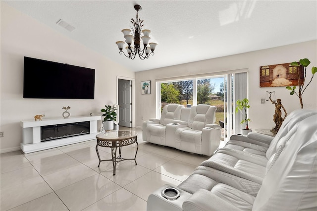 living room featuring vaulted ceiling, a textured ceiling, light tile patterned floors, visible vents, and an inviting chandelier