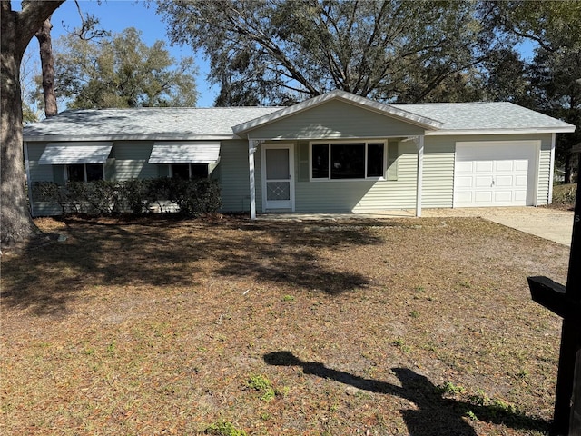 single story home featuring driveway and an attached garage