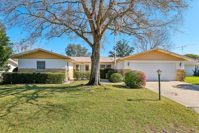ranch-style home with an attached garage, driveway, a front lawn, and brick siding