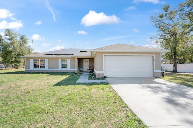 ranch-style home with concrete driveway, solar panels, stucco siding, an attached garage, and a front yard