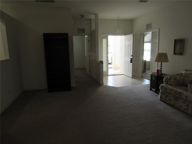 2459 NW 55th Avenue Rd, Ocala, FL 34482 - carpeted living area featuring tile patterned flooring and visible vents