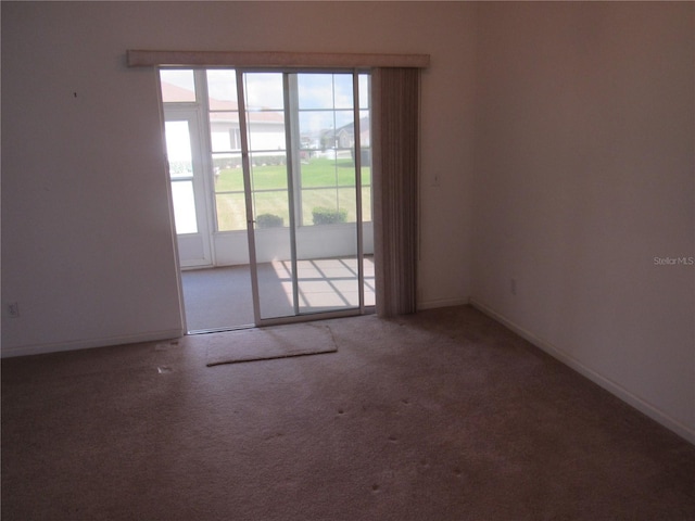 2459 NW 55th Avenue Rd, Ocala, FL 34482 - spare room featuring carpet and baseboards