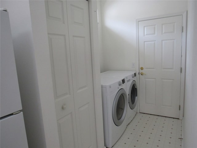 2459 NW 55th Avenue Rd, Ocala, FL 34482 - washroom featuring laundry area, light floors, and washer and dryer