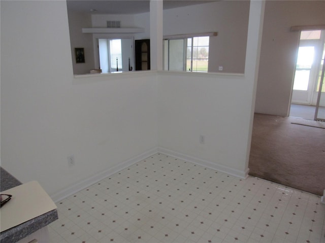 2459 NW 55th Avenue Rd, Ocala, FL 34482 - spare room with a healthy amount of sunlight, visible vents, baseboards, and tile patterned floors